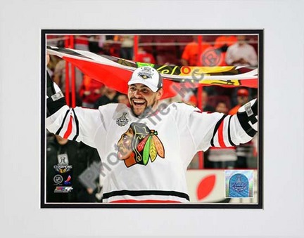 Dustin Byfuglien with Chicago Blackhawks Flag 2010 Stanley Cup Finals (#35) Double Matted 8” x 10” Photograph (Unfra