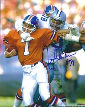 John Dutton Autographed Dallas Cowboys 8" x 10" Photograph Sacking John Elway (Unframed)